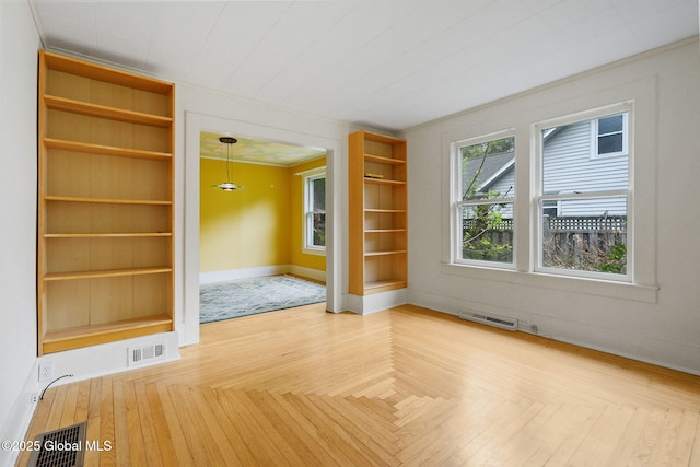 406 Northern Pines Rd, Wilton, NY 12831 - spare room with baseboards, built in features, and ornamental molding