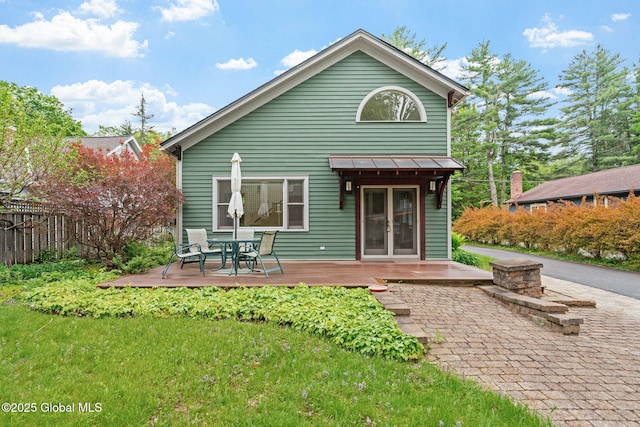 406 Northern Pines Rd, Wilton, NY 12831 - rear view of property featuring a wooden deck, a standing seam roof, metal roof, and outdoor dining area