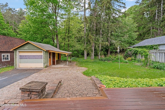 406 Northern Pines Rd, Wilton, NY 12831 - wooden terrace with a detached garage and asphalt driveway
