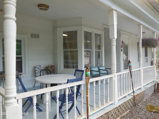 114 Washington St, Sharon Springs, NY 13459 - covered porch featuring outdoor dining space