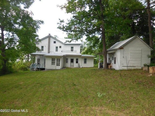 114 Washington St, Sharon Springs, NY 13459 - back of property featuring a yard and metal roof