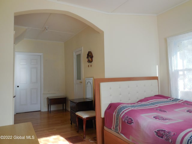 114 Washington St, Sharon Springs, NY 13459 - bedroom with wood finished floors, arched walkways, and ornamental molding