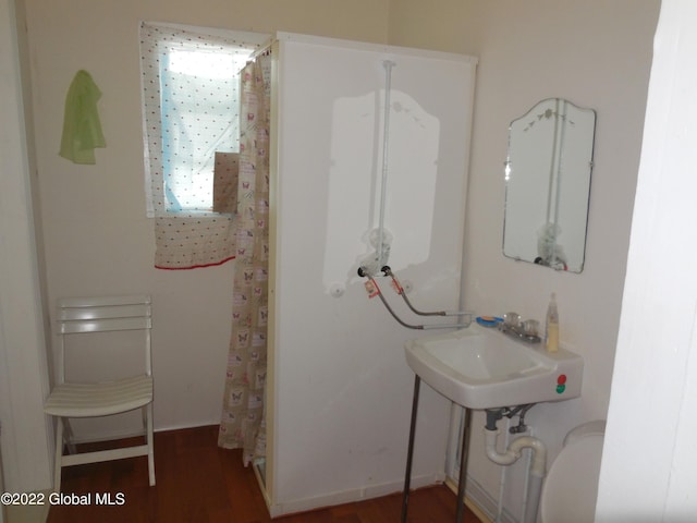 114 Washington St, Sharon Springs, NY 13459 - full bath with wood finished floors, curtained shower, and a sink