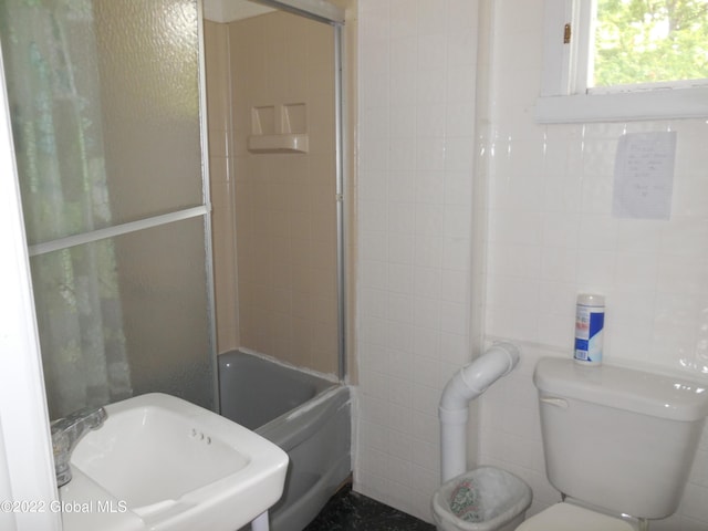 114 Washington St, Sharon Springs, NY 13459 - bathroom featuring a sink, toilet, tile walls, and shower / bath combination with glass door