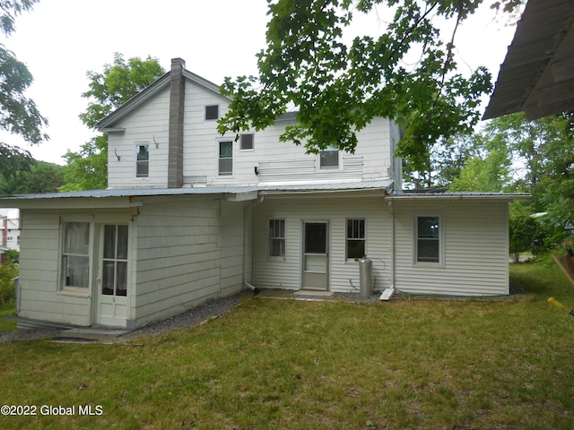114 Washington St, Sharon Springs, NY 13459 - back of house featuring a lawn