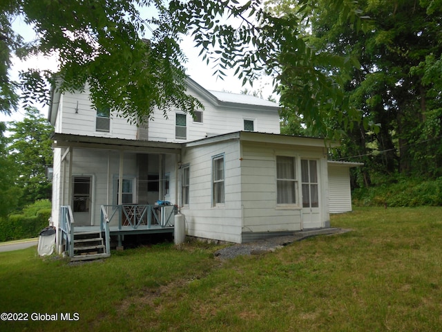 114 Washington St, Sharon Springs, NY 13459 - rear view of house featuring a yard