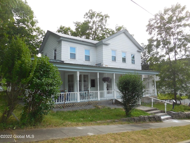 114 Washington St, Sharon Springs, NY 13459 - farmhouse-style home with a porch