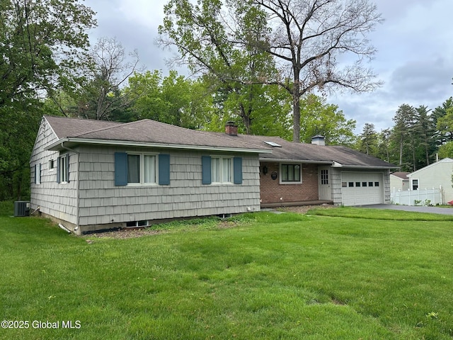 5 Wincrest Dr, Queensbury, NY 12804 - single story home with an attached garage, a chimney, asphalt driveway, a front yard, and central AC unit