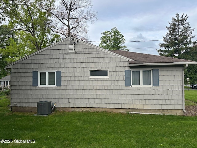 5 Wincrest Dr, Queensbury, NY 12804 - view of property exterior featuring central AC unit, a lawn, and a shingled roof