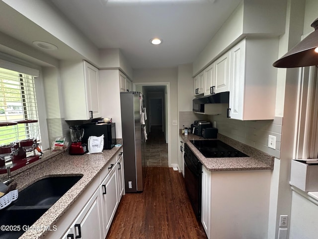 5 Wincrest Dr, Queensbury, NY 12804 - kitchen featuring black electric stovetop, freestanding refrigerator, a sink, white cabinetry, and dark wood-type flooring