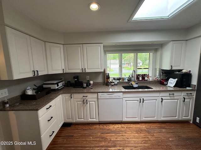 5 Wincrest Dr, Queensbury, NY 12804 - kitchen with white dishwasher, a sink, white cabinets, dark wood-type flooring, and recessed lighting