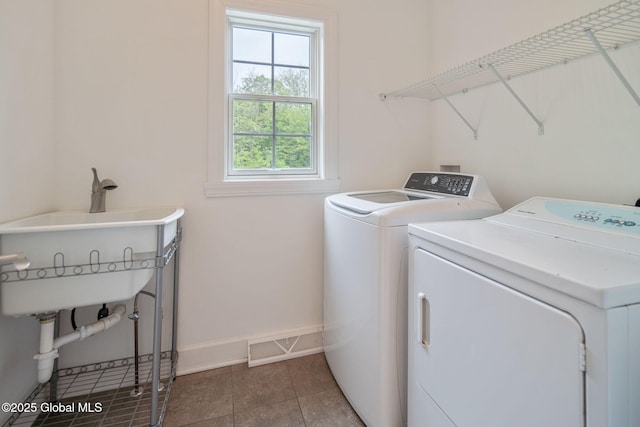 45 Tamarack Ln, Colonie, NY 12309 - laundry room with separate washer and dryer, baseboards, and tile patterned floors