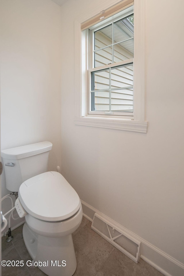 45 Tamarack Ln, Colonie, NY 12309 - bathroom featuring toilet, baseboards, and tile patterned flooring