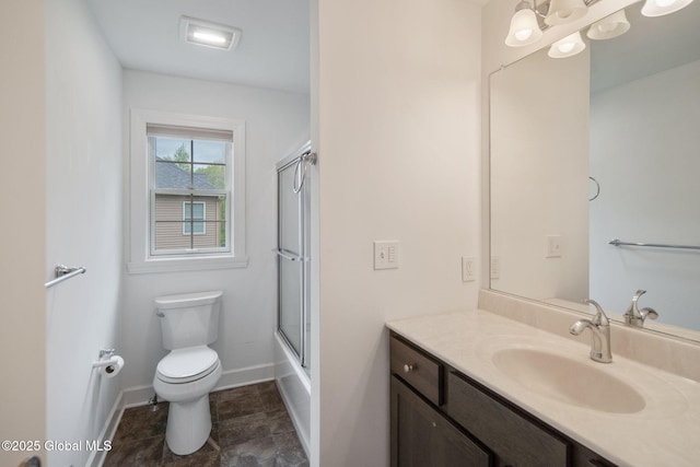 45 Tamarack Ln, Colonie, NY 12309 - full bath with toilet, vanity, baseboards, and bath / shower combo with glass door