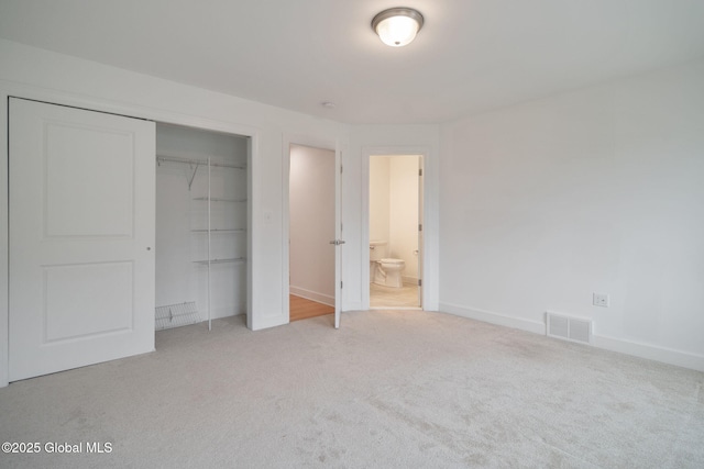 45 Tamarack Ln, Colonie, NY 12309 - unfurnished bedroom with carpet floors, a closet, baseboards, and ensuite bath