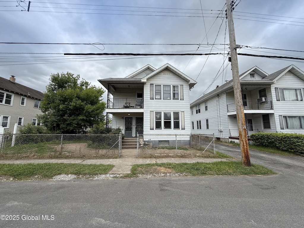 76 3rd St, Cohoes, NY 12047 - multi unit property featuring a balcony and a fenced front yard