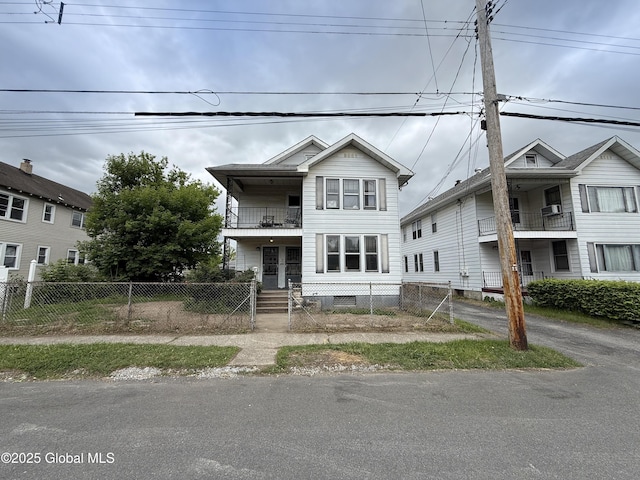 76 3rd St, Cohoes, NY 12047 - multi unit property featuring a balcony and a fenced front yard