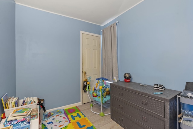 797 Eastern Ave, Schenectady, NY 12308 - bedroom with light wood-style floors, crown molding, and baseboards