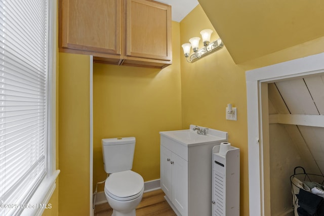 797 Eastern Ave, Schenectady, NY 12308 - bathroom featuring toilet, vanity, and wood finished floors