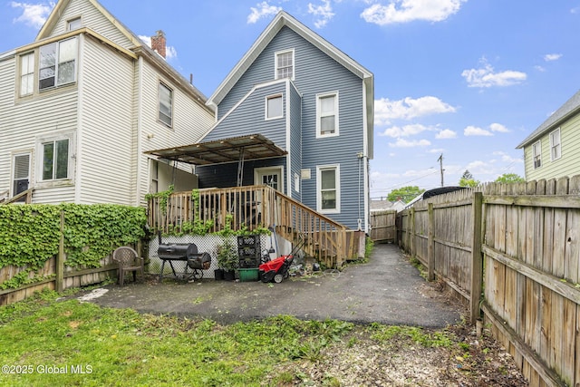 797 Eastern Ave, Schenectady, NY 12308 - rear view of house with a fenced backyard and a deck