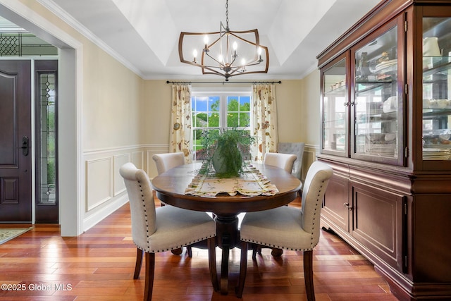 41 Tipperary Way, Clifton Park, NY 12019 - dining room with a chandelier, wood finished floors, a wainscoted wall, a decorative wall, and ornamental molding