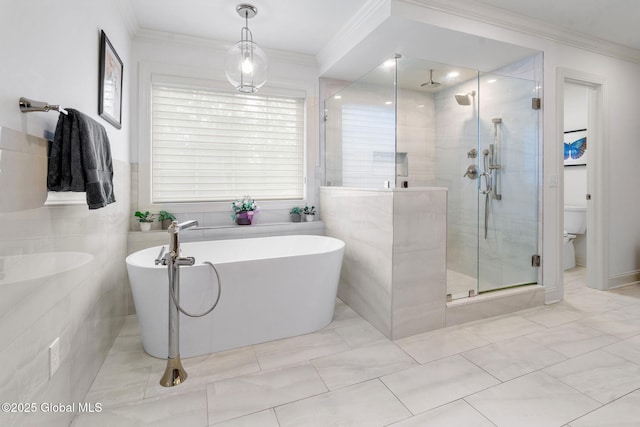 41 Tipperary Way, Clifton Park, NY 12019 - bathroom with a stall shower, crown molding, a freestanding bath, toilet, and tile walls