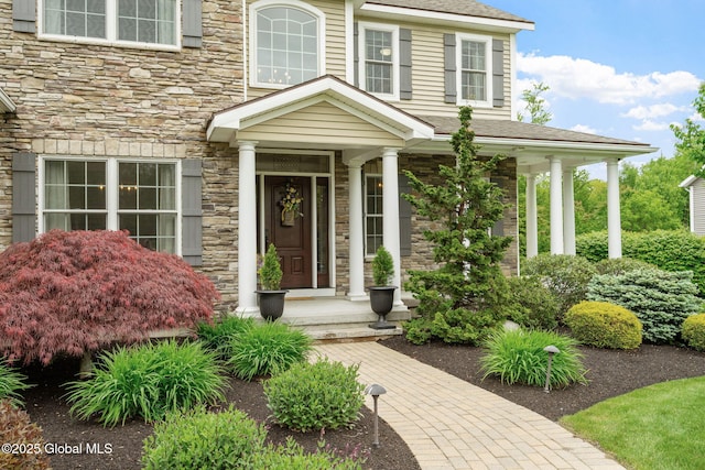 41 Tipperary Way, Clifton Park, NY 12019 - view of exterior entry with stone siding and roof with shingles