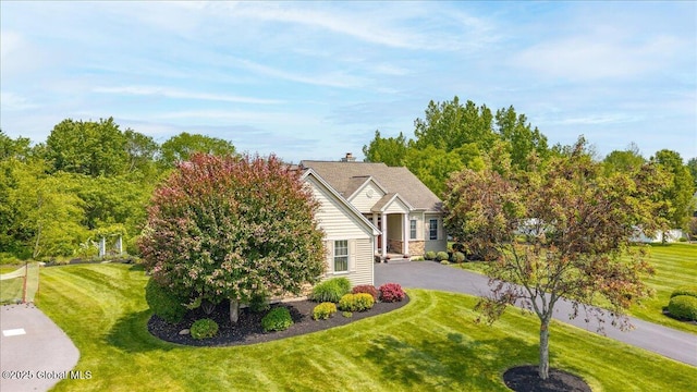 19 Hidden Farm Ln, Halfmoon, NY 12118 - obstructed view of property with a front yard and asphalt driveway