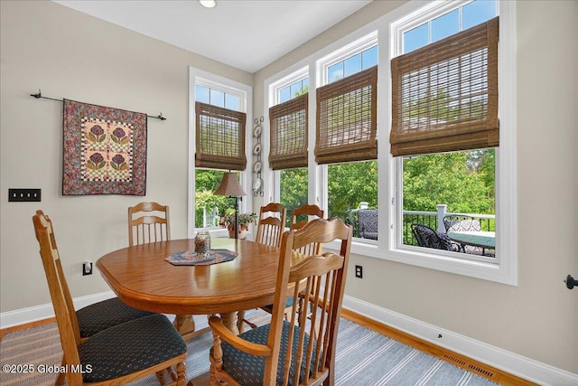 19 Hidden Farm Ln, Halfmoon, NY 12118 - dining space featuring baseboards and wood finished floors