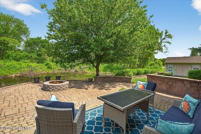 19 Hidden Farm Ln, Halfmoon, NY 12118 - view of patio featuring a fire pit and an outdoor structure