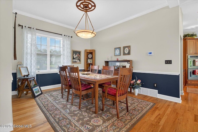19 Hidden Farm Ln, Halfmoon, NY 12118 - dining space featuring light wood-type flooring, baseboards, and ornamental molding