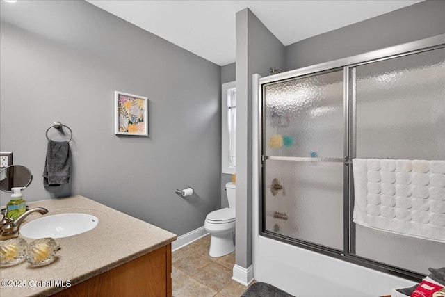 19 Hidden Farm Ln, Halfmoon, NY 12118 - full bath featuring toilet, combined bath / shower with glass door, tile patterned flooring, baseboards, and vanity