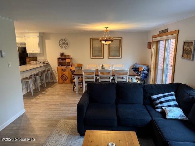 30 Freebern Rd Unit 30C, Johnsburg, NY 12853 - living room with wood finished floors and baseboards