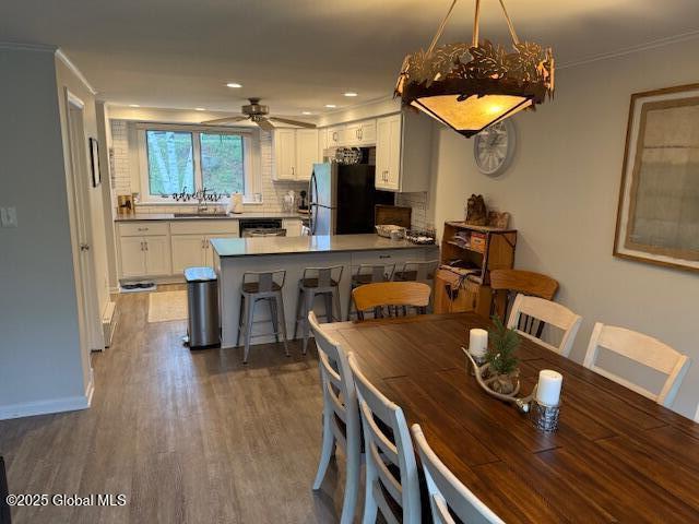 30 Freebern Rd Unit 30C, Johnsburg, NY 12853 - dining area featuring dark wood finished floors, ceiling fan, crown molding, baseboards, and recessed lighting