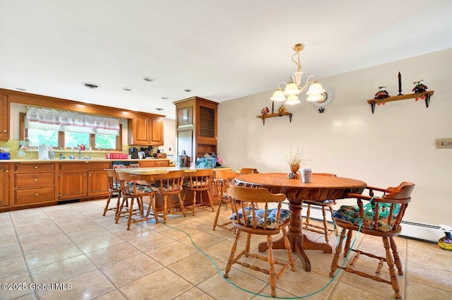 8 Adams Ave, East Greenbush, NY 12144 - dining room featuring a chandelier, light tile patterned flooring, and a baseboard radiator