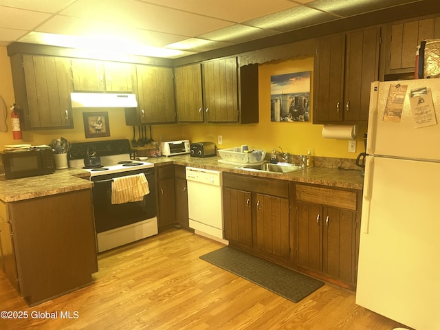11K Overlook Ln, Warrensburg, NY 12817 - kitchen with white appliances, a sink, under cabinet range hood, light wood finished floors, and a paneled ceiling