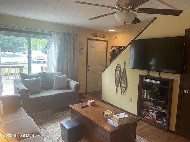 11K Overlook Ln, Warrensburg, NY 12817 - living room featuring ceiling fan, wood finished floors, and a textured ceiling