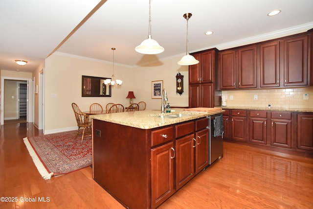 509 Lois Ln, Niskayuna, NY 12304 - kitchen featuring a sink, light wood-style floors, stainless steel dishwasher, ornamental molding, and recessed lighting