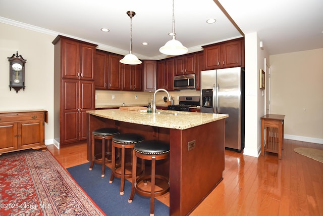 509 Lois Ln, Niskayuna, NY 12304 - kitchen featuring stainless steel appliances, backsplash, a sink, wood-type flooring, and recessed lighting