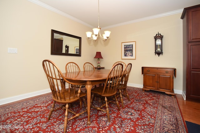 509 Lois Ln, Niskayuna, NY 12304 - dining space featuring a chandelier, crown molding, baseboards, and dark wood-style flooring