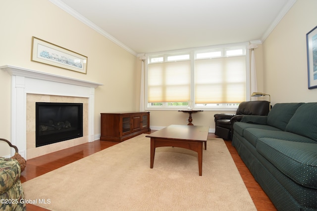 509 Lois Ln, Niskayuna, NY 12304 - living area featuring ornamental molding, wood finished floors, a tile fireplace, and baseboards