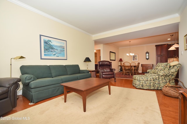 509 Lois Ln, Niskayuna, NY 12304 - living area featuring crown molding, a chandelier, and wood finished floors