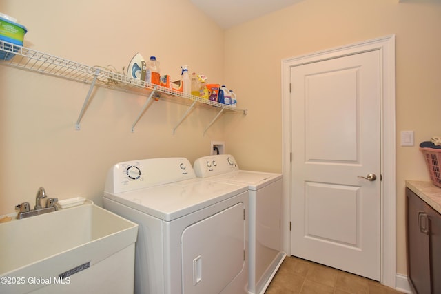 509 Lois Ln, Niskayuna, NY 12304 - laundry room with independent washer and dryer, light tile patterned floors, and baseboards