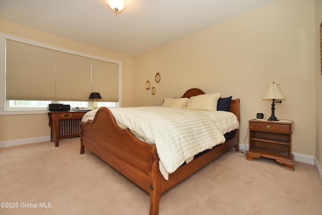 509 Lois Ln, Niskayuna, NY 12304 - bedroom with radiator heating unit, light carpet, and baseboards