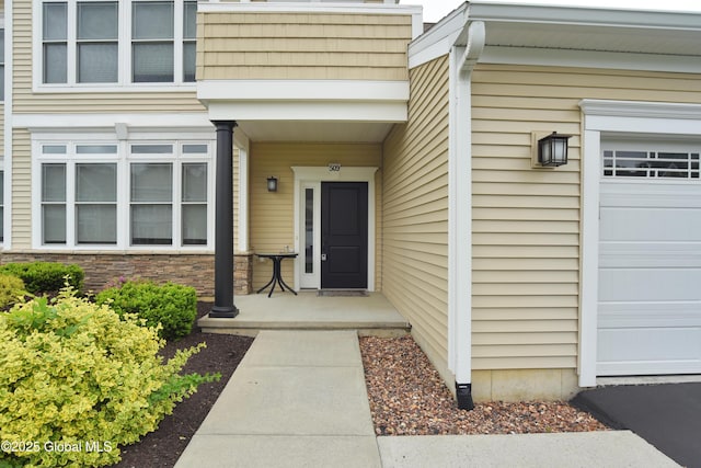 509 Lois Ln, Niskayuna, NY 12304 - view of exterior entry featuring an attached garage