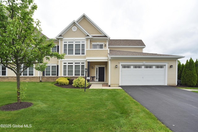 509 Lois Ln, Niskayuna, NY 12304 - view of front facade with asphalt driveway, an attached garage, and a front lawn