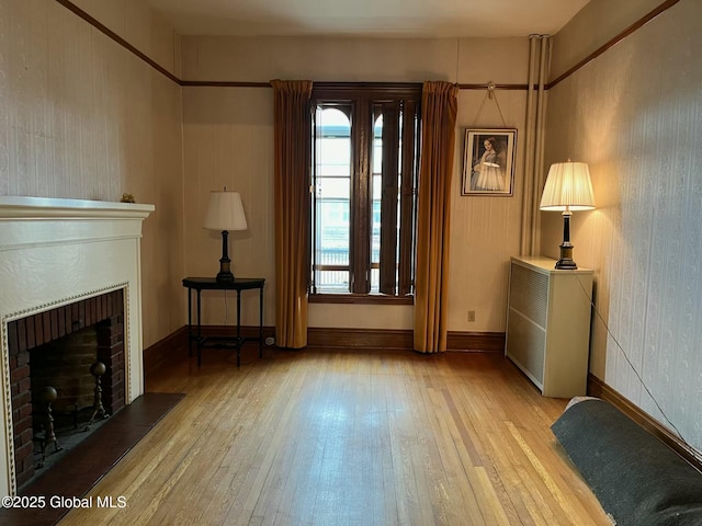 1466 3rd St, Rensselaer, NY 12144 - living room with hardwood / wood-style floors and a fireplace