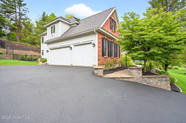 779 Waldens Pond, Guilderland, NY 12203 - view of home's exterior featuring driveway and an attached garage