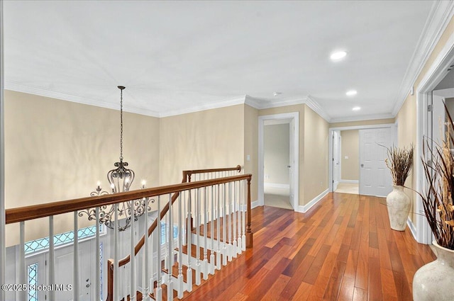 779 Waldens Pond, Guilderland, NY 12203 - hall with a chandelier, an upstairs landing, wood-type flooring, baseboards, and recessed lighting