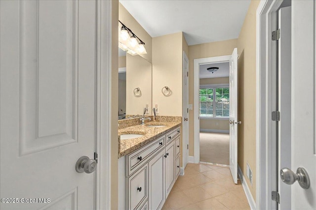 779 Waldens Pond, Guilderland, NY 12203 - full bathroom with double vanity, baseboards, and tile patterned floors